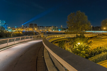 Road Traffic and Subway in Paris at Night From Curve Bridge Above Highway With Eiffel Tower