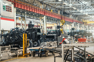Conveyor for assembly of modern agricultural machinery. Production of tractors and combines at automated plant or factory.