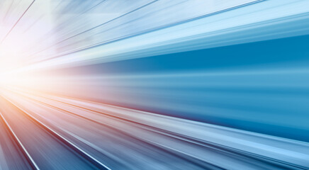 Blue high speed train runs on rail tracks -Train in motion