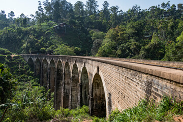 Fototapeta na wymiar Ella, Sri Lanka Unidentified people walking across the Nine arches bridge