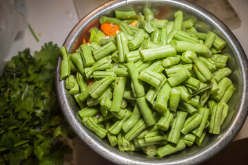 Galle, Sri Lanka A bowl of freshly cut haricots verts beans.