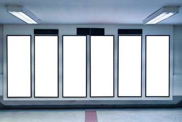 Row of empty digital vertical billboard on wall