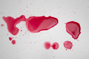 Drops of blood drip on the white background