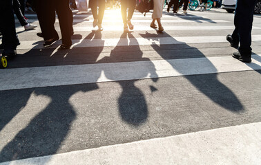 Shadows of people on the crosswalk - obrazy, fototapety, plakaty