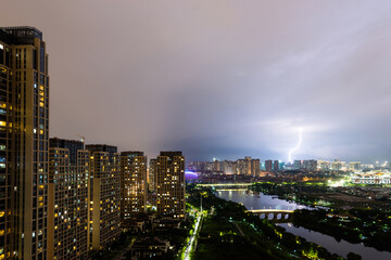 Lightning over the city at dusk