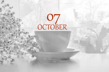 calendar date on light background with porcelain white tea pair and white gypsophila with copy...