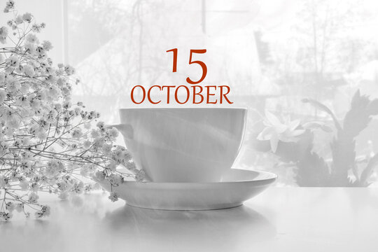 calendar date on light background with porcelain white tea pair and white gypsophila with copy space. October 15 is the fifteenth day of the month