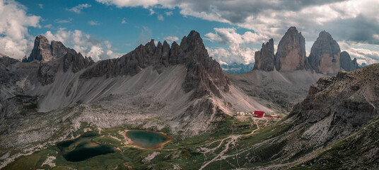 Lakes Lago dei Piani with Paternkofel mountains and Three Peaks Hut in the Dolomite Alps in South Tyrol during summer with blue sky from above, Italy.