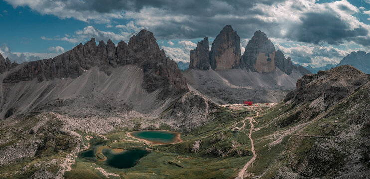 Lakes Lago dei Piani with Paternkofel mountains and Three Peaks Hut in the Dolomite Alps in South Tyrol during summer with blue sky from above, Italy.