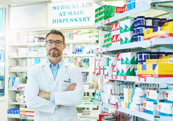 Fototapeta na wymiar Hes the medication specialist. Portrait of a confident mature pharmacist working in a pharmacy.