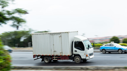 White truck driving on the highway