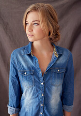 Denim is the way to go. Shot of a beautiful woman posing indoors.