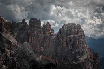 Mountain cliffs at Three Peaks in the Dolomite Alps in South Tyrol during summer with clouds.