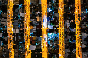 Aerial view from top. Old apartment in Kowloon, Hong Kong at night, buidings exterior
