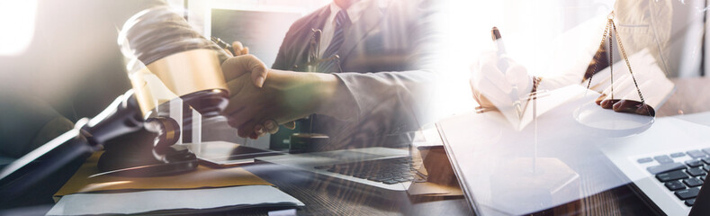 Business and lawyers discussing contract papers with brass scale on desk in office. Law, legal...