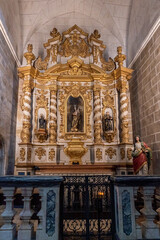 Fototapeta na wymiar view of one of the ornate side altars in the Church of San Francisco in Evora