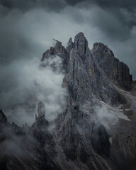 Mountain peaks in the Dolomite Alps in South Tyrol with dramatic cloudy sky, Three Peaks Nature Reserve, Italy.