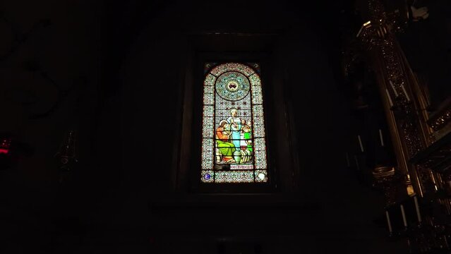 Stained glass window in Montserrat. Mount Montserrat in Spain. The famous monastery of Montserrat. Mountain retreat of the Benedictine monks. Jagged mountain