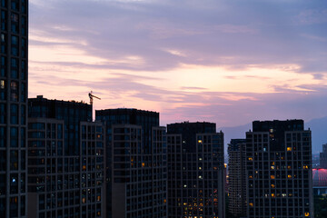 Modern skyscrapers in the city at dusk