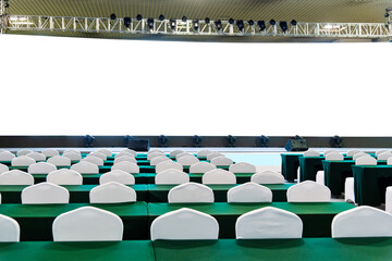 Group of chairs and table in empty auditorium