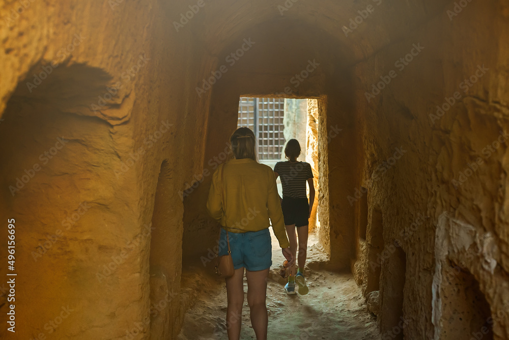 Wall mural Family visiting Tombs of the Kings in Paphos.