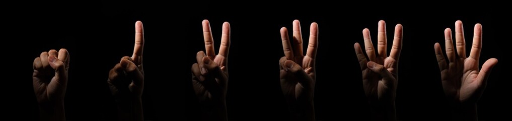 Black counting hands from one to five, isolated over black background
