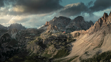 Panorama at Rifugio Three Peaks Hut with Sasso di Sesto summit and Rocca dei Baranci in the Dolomite Alps in South Tyrol during sunset, Italy. - obrazy, fototapety, plakaty