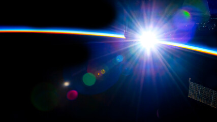Sunrise over planet Earth. Digital enhancement. Elements by NASA