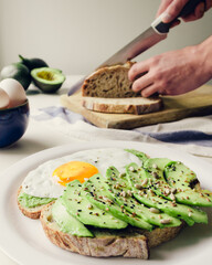 healthy breakfast with tasty avocado and Delicious wholewheat toast. sliced avocado on toast bread with egg. Mexican cuisine