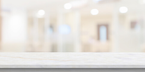 Marble table top with blur hospital clinic medical interior background - obrazy, fototapety, plakaty