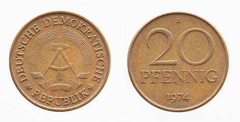 Germany East GDR - circa 1974: a 20  Pfenning coin of the GDR with the Hammer and Zirkle coat of...