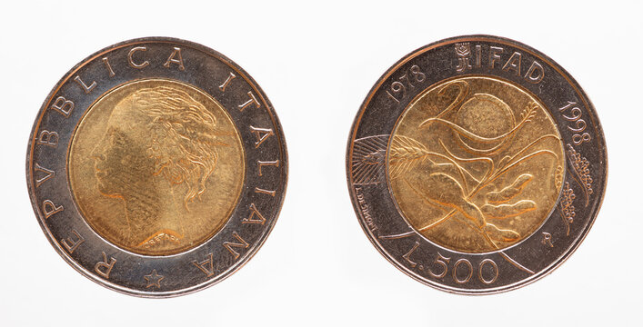 Italy - circa 1998: a 500 lire coin of Italy showing a woman's head and an outstretched hand as a symbol of 20 years of the International Fund for Agricultural Development IFAD