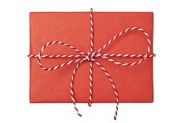 Christmas gift box wrapped in red paper with striped rope bow isolated on white background