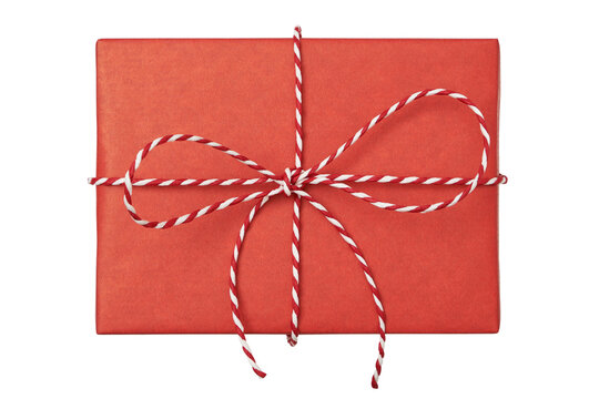 Christmas gift box wrapped in red paper with striped rope bow isolated on white background