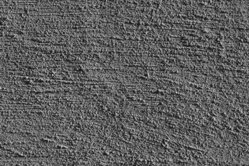 gray background. in the photo, gray decorative plaster on the wall.