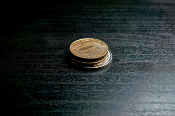 Stack of Russian rubles coins on black table
