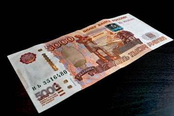 Five thousand ruble bill on a black table