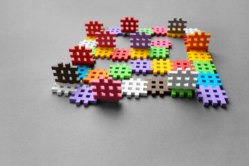 Multicolored puzzles on a gray background