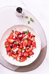 Fresh salad with strawberries,basil sprouts and feta cheese	