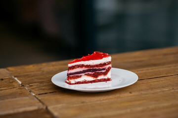 Cake on a plate. Delicious cake on a cafe background.