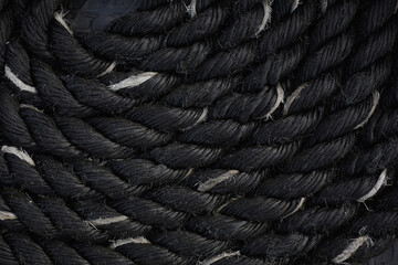 close up of a rope on a ship in black