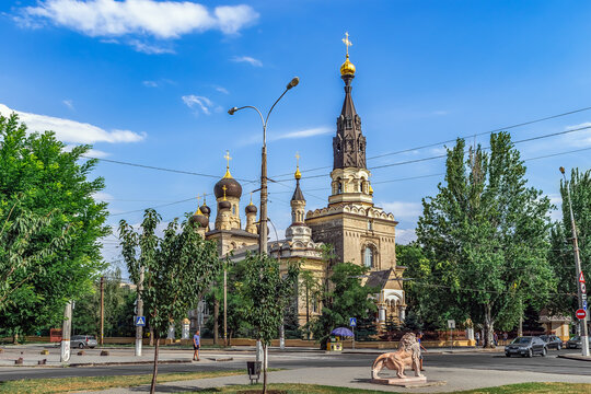 Mykolaiv, Ukraine - July 26, 2020: View of Cathedral of Our Lady Mother of Kasperovskaya from the Square of Council Europe in Mykolayiv. City street with cars on the road and beautiful architecture