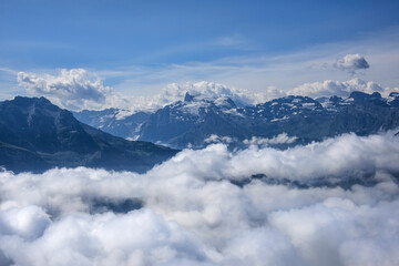 Naklejka premium Swiss Alps Above the Clouds