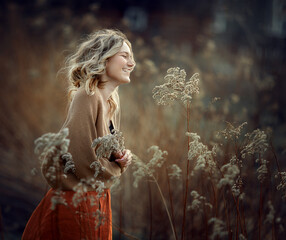 a girl in early spring in a flowering willow, photos with noise effect and selective focus