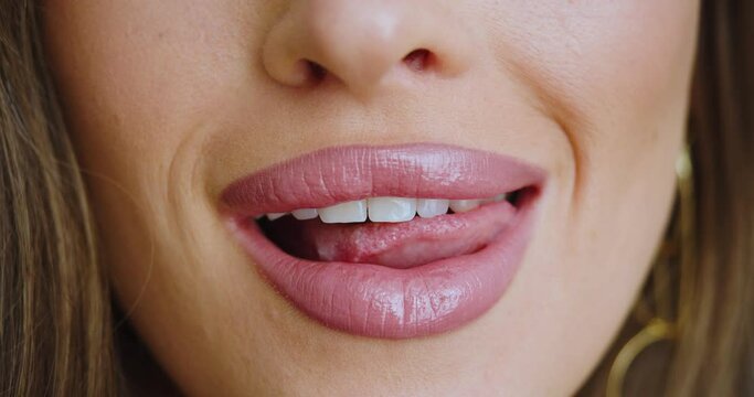 Female lips close-up - she kissing and flirting.