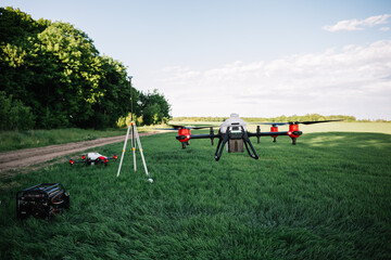 Obraz na płótnie Canvas Agriculture drone flying on the green tea field at sunrise