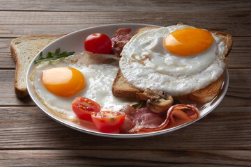 Baked omeletter on bread with bacon on wooden background