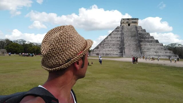 Tourist man visit Chichen Itza is a large pre-Columbian city built by the Maya people which has Mesoamerican Pyramids. The archeological site is located in Tin&uacute;m Municipality, Yucat&aacute;n State, Mexico.