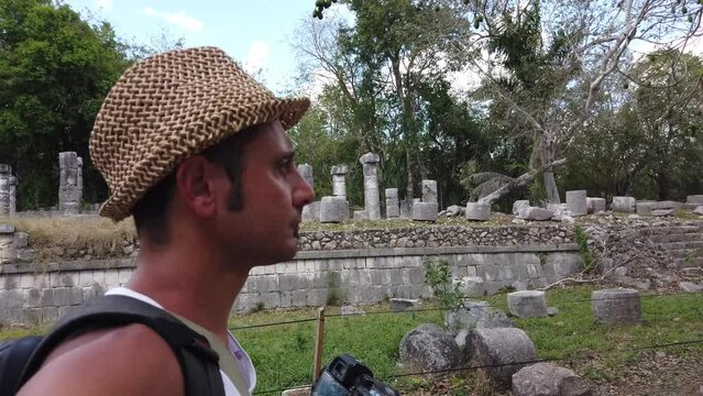 Tourist man visit Chichen Itza is a large pre-Columbian city built by the Maya people which has Mesoamerican Pyramids. The archeological site is located in Tin&uacute;m Municipality, Yucat&aacute;n State, Mexico.