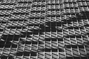 gray background, in the photo,metal lattice flooring.